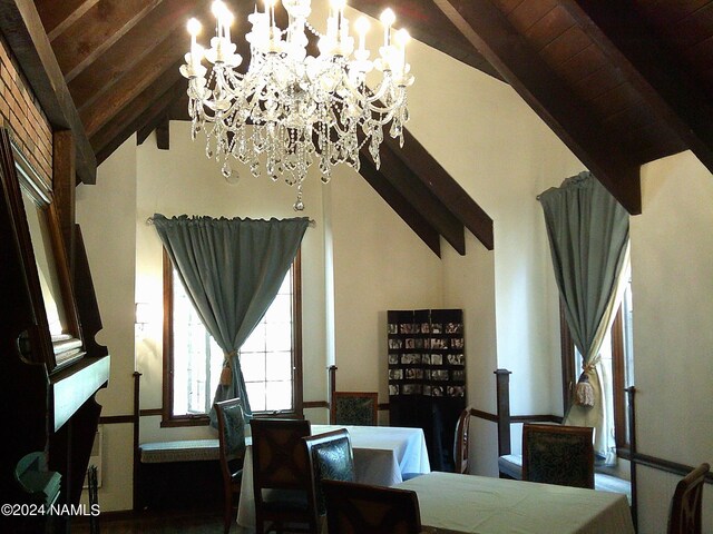 dining area with wood ceiling and vaulted ceiling with beams