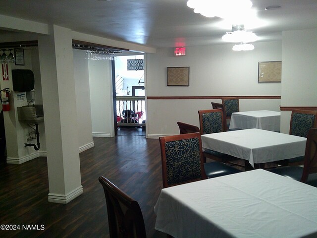 dining area featuring dark wood-type flooring