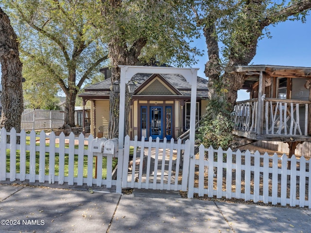 view of front of property featuring covered porch and french doors