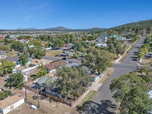 birds eye view of property with a mountain view