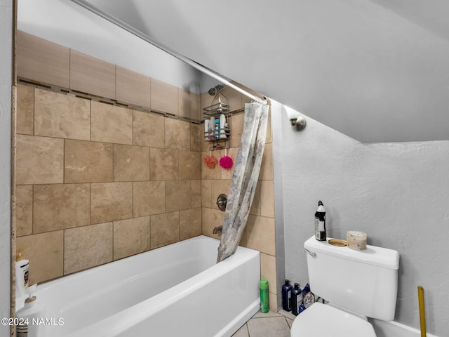 bathroom featuring toilet, shower / bath combination with curtain, and tile patterned floors