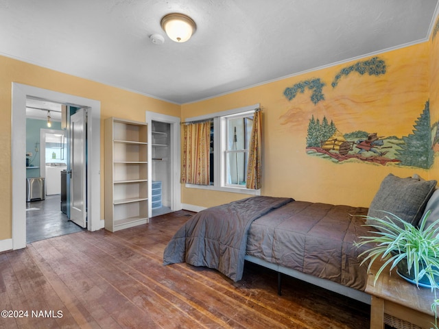 bedroom with hardwood / wood-style floors