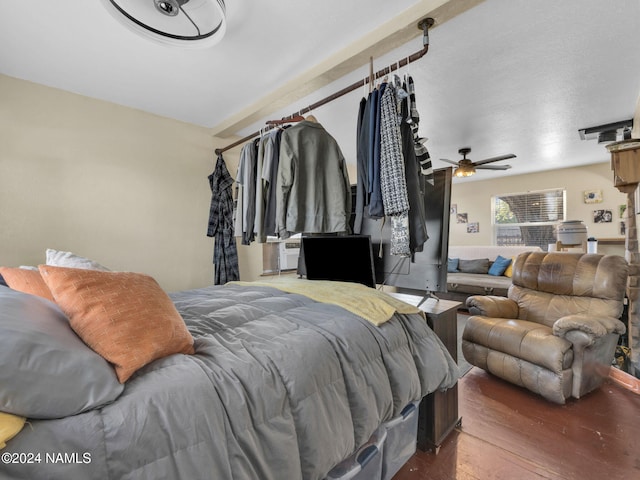 bedroom with dark wood-type flooring and ceiling fan