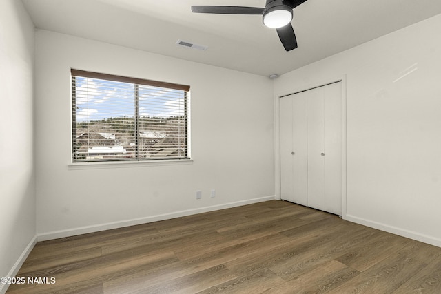 501 W Santa Fe Ave Unit 3, Flagstaff, AZ 86001 - unfurnished bedroom with wood finished floors, visible vents, and baseboards