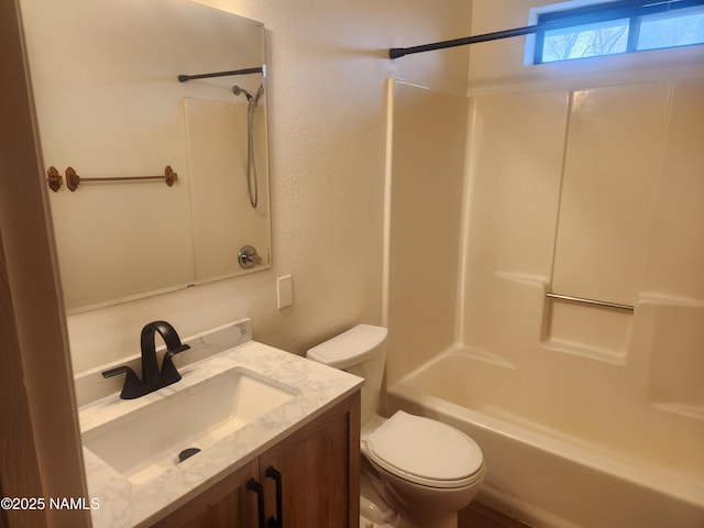 501 W Santa Fe Ave Unit 3, Flagstaff, AZ 86001 - bathroom with tub / shower combination, toilet, vanity, and a textured wall