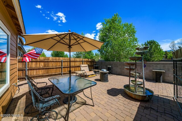 9129 W Arden Ln, Bellemont, AZ 86015 - fenced backyard with a patio area