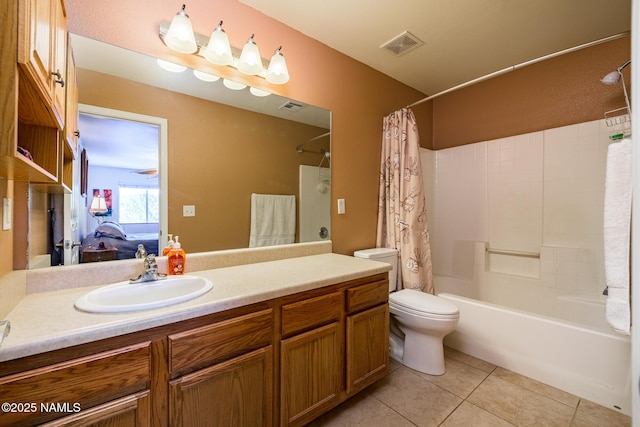 9129 W Arden Ln, Bellemont, AZ 86015 - full bath with shower / tub combo with curtain, vanity, toilet, tile patterned flooring, and connected bathroom