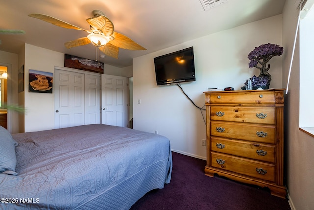 9129 W Arden Ln, Bellemont, AZ 86015 - bedroom featuring dark colored carpet, ceiling fan, baseboards, and a closet