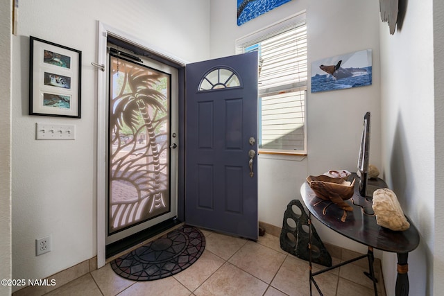 9129 W Arden Ln, Bellemont, AZ 86015 - foyer entrance featuring light tile patterned flooring and baseboards