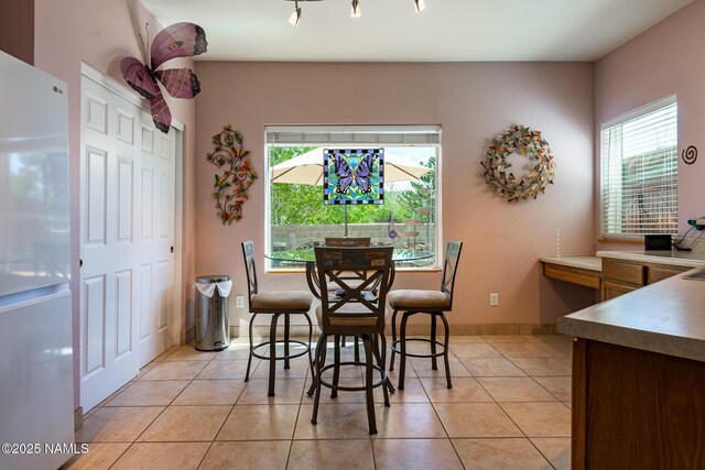 9129 W Arden Ln, Bellemont, AZ 86015 - dining room with plenty of natural light and light tile patterned floors