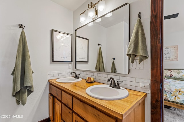 435 N Laramy Ln, Parks, AZ 86018 - ensuite bathroom featuring tasteful backsplash and double vanity