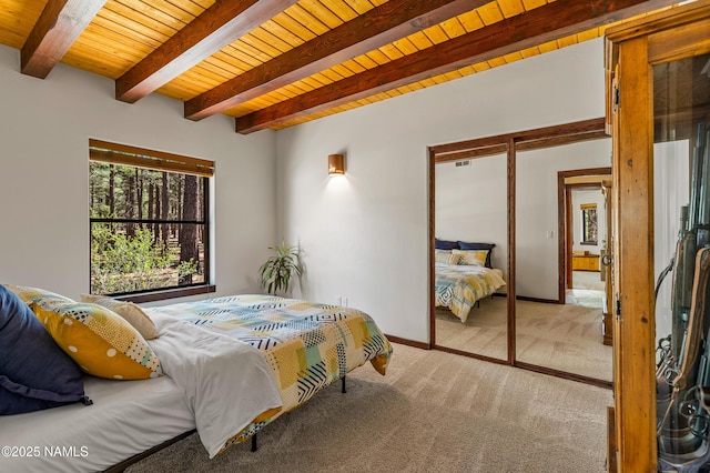 435 N Laramy Ln, Parks, AZ 86018 - carpeted bedroom with wooden ceiling, beam ceiling, a closet, and baseboards