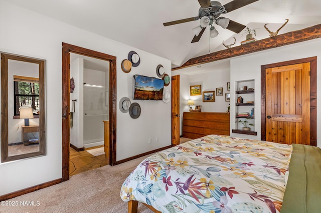 435 N Laramy Ln, Parks, AZ 86018 - bedroom featuring light carpet, vaulted ceiling, baseboards, and ensuite bath