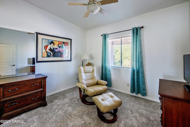 sitting room featuring light colored carpet, vaulted ceiling, and ceiling fan