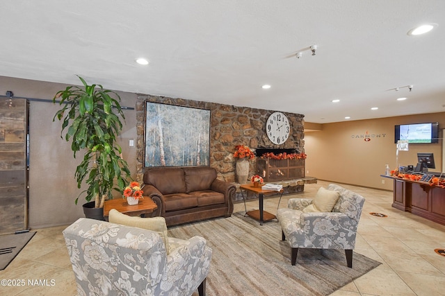 living room with light tile patterned floors and a fireplace