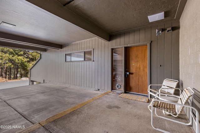 entrance to property with a patio area