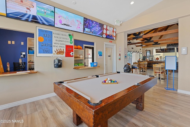 rec room featuring pool table, vaulted ceiling, and light hardwood / wood-style flooring