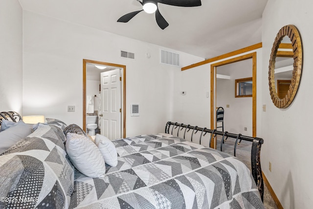 carpeted bedroom featuring ceiling fan and ensuite bath