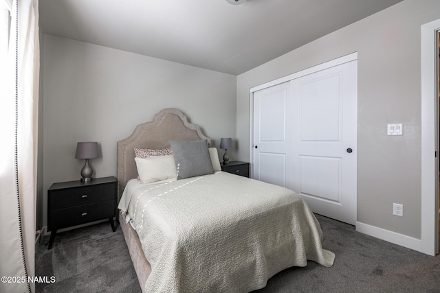 bedroom featuring dark carpet and a closet