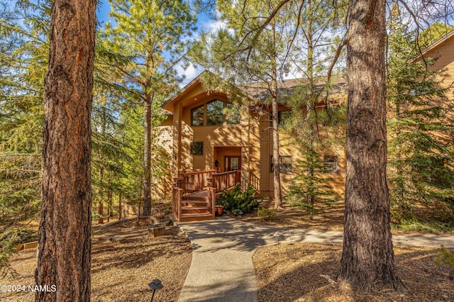 rustic home featuring a wooden deck