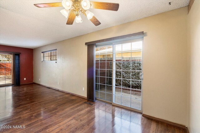 unfurnished room featuring ceiling fan, a textured ceiling, and wood-type flooring