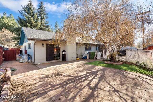 rear view of house featuring a patio area