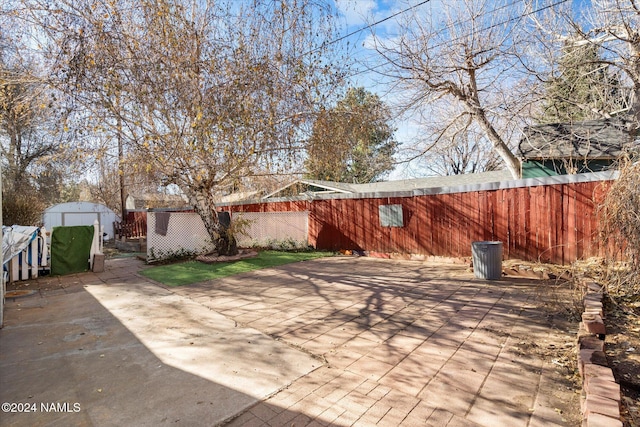 view of patio with a shed