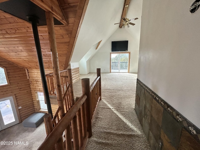 8120 N Cassity Trl, Williams, AZ 86046 - stairway with carpet floors, vaulted ceiling, log walls, plenty of natural light, and ceiling fan