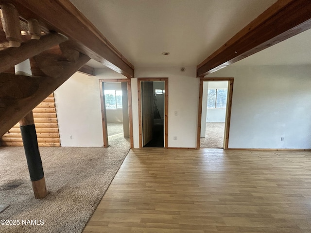 8120 N Cassity Trl, Williams, AZ 86046 - unfurnished room with plenty of natural light, beam ceiling, wood finished floors, and baseboards