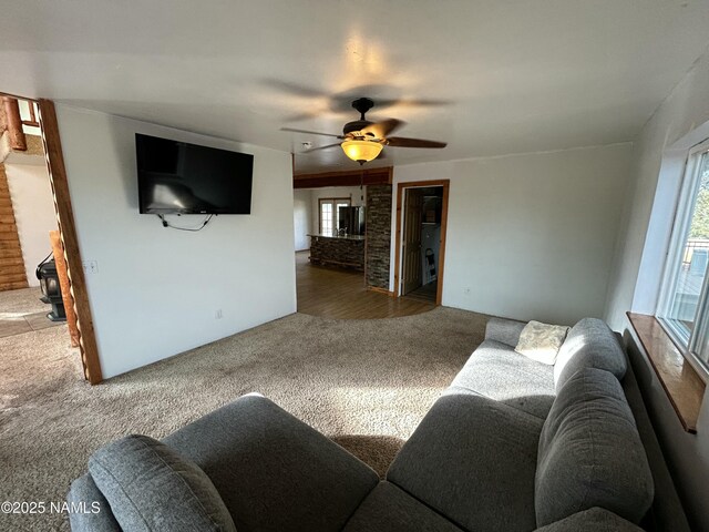 8120 N Cassity Trl, Williams, AZ 86046 - carpeted living area featuring healthy amount of natural light and a ceiling fan