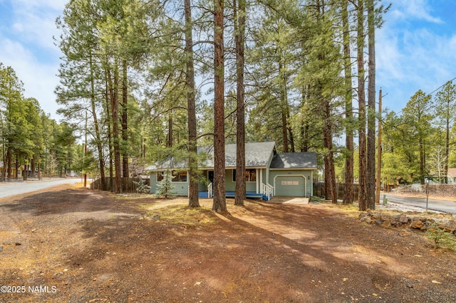 2828 Kweo Trl, Flagstaff, AZ 86005 - ranch-style home with an attached garage, driveway, and covered porch