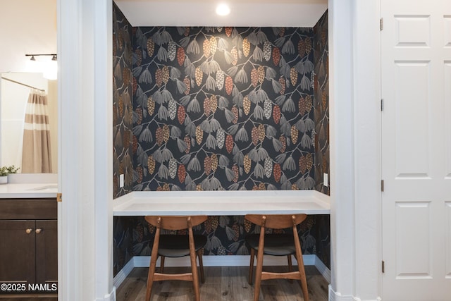 3600 W Modus Ln, Flagstaff, AZ 86001 - dining space featuring wood finished floors, wallpapered walls, and baseboards