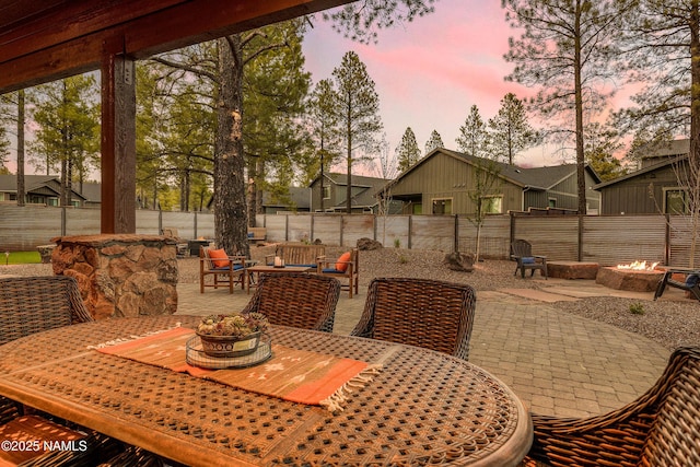3600 W Modus Ln, Flagstaff, AZ 86001 - view of patio / terrace with outdoor dining area, a fenced backyard, and an outdoor living space with a fire pit