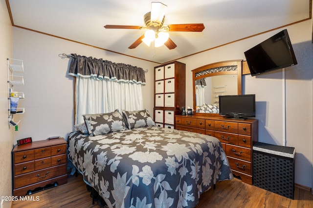 bedroom featuring ceiling fan, ornamental molding, and dark hardwood / wood-style floors