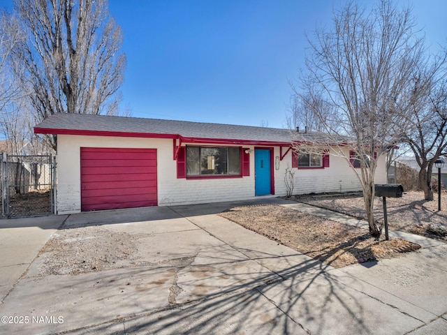 ranch-style home featuring a garage