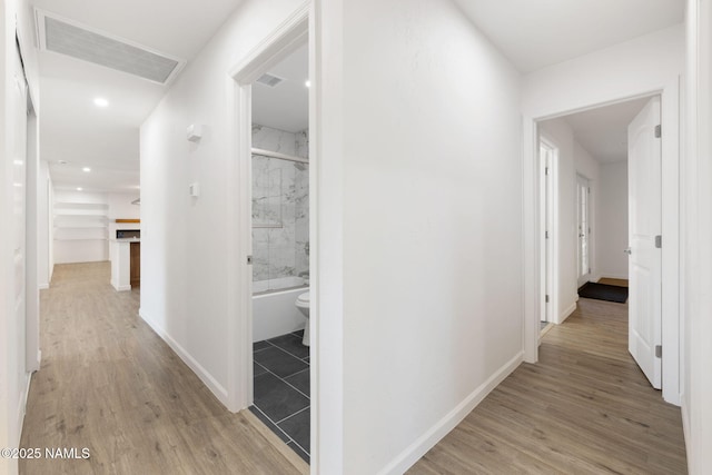 3540 N Walker St, Flagstaff, AZ 86004 - hallway with baseboards, visible vents, and light wood-style flooring