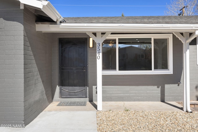 3540 N Walker St, Flagstaff, AZ 86004 - doorway to property featuring roof with shingles