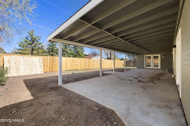 3540 N Walker St, Flagstaff, AZ 86004 - view of patio with french doors, a fenced backyard, and a carport