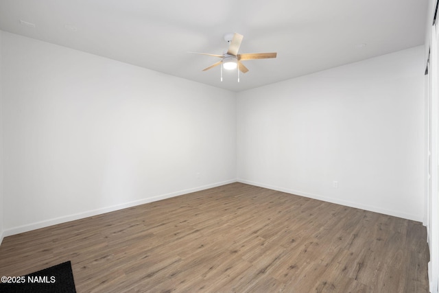 3540 N Walker St, Flagstaff, AZ 86004 - spare room featuring wood finished floors, a ceiling fan, and baseboards
