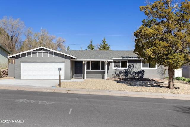 3540 N Walker St, Flagstaff, AZ 86004 - ranch-style home featuring brick siding, roof with shingles, driveway, and a garage