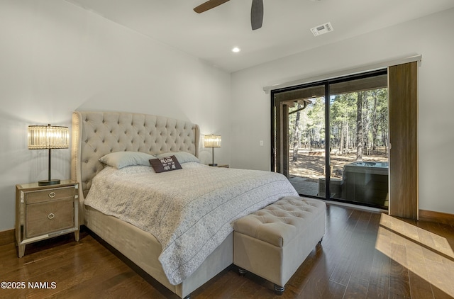 bedroom with access to outside, dark wood-style flooring, visible vents, and baseboards