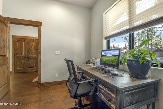 office with wood finished floors and baseboards