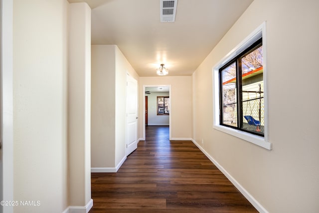 hall with dark hardwood / wood-style flooring