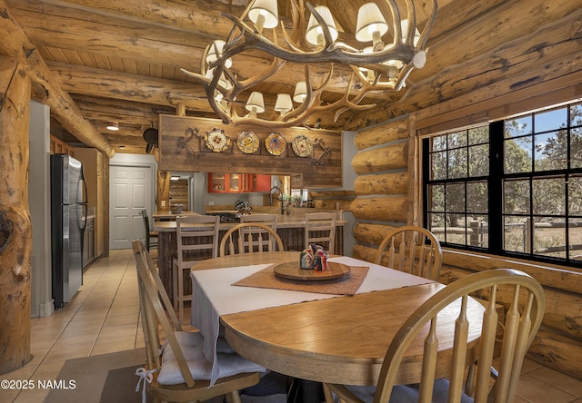 38 Cosnino Rd, Flagstaff, AZ 86004 - dining room featuring rustic walls, light tile patterned floors, a chandelier, and beamed ceiling