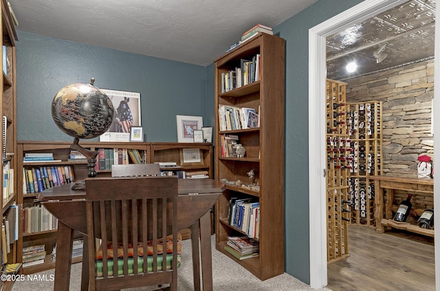 38 Cosnino Rd, Flagstaff, AZ 86004 - wine cellar featuring wood finished floors and a textured ceiling