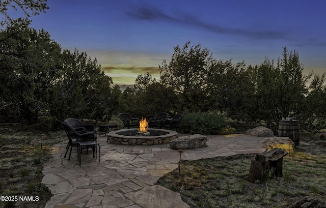 38 Cosnino Rd, Flagstaff, AZ 86004 - patio terrace at dusk with an outdoor fire pit and a patio