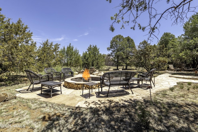38 Cosnino Rd, Flagstaff, AZ 86004 - view of patio featuring an outdoor fire pit