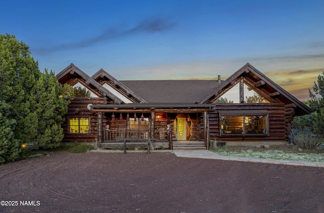 38 Cosnino Rd, Flagstaff, AZ 86004 - log home featuring log siding and a porch