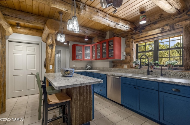 38 Cosnino Rd, Flagstaff, AZ 86004 - kitchen featuring blue cabinetry, dishwasher, a sink, light tile patterned floors, and wooden ceiling with exposed beams