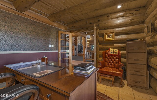 38 Cosnino Rd, Flagstaff, AZ 86004 - home office featuring wainscoting, rustic walls, wallpapered walls, light tile patterned floors, and wood ceiling with exposed beams
